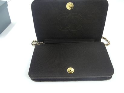 CHANEL. Brown jersey clutch bag, chain handle...
