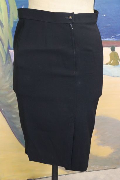 CHANEL. Meeting of two black wool skirts,...