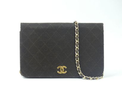 CHANEL. Brown jersey clutch bag, chain handle...