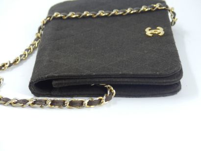 CHANEL. Brown jersey clutch bag, chain handle...