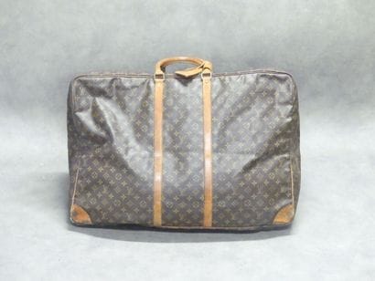 LOUIS VUITTON. Large soft suitcase in monogram...