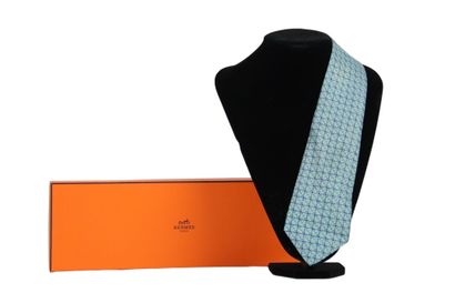Hermes tie in its box, blue gray color. Very...