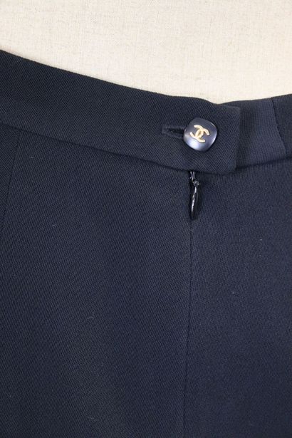 CHANEL. Meeting of two black wool skirts,...