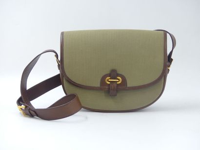HERMES. Green canvas and leather golf ball...