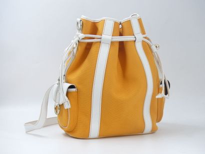 LANCEL. Orange canvas bucket bag with its...