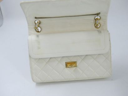 CHANEL. Classic quilted bag in white lambskin,...