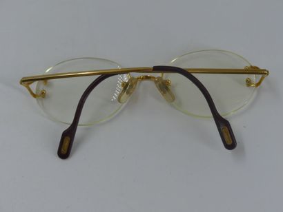 CARTIER, Must. Pair of eyeglasses with gold...