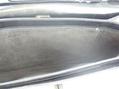 GUCCI. Black leather clutch bag, gold metal...