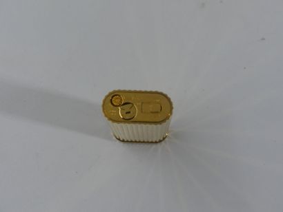 CARTIER. Lighter in gilded metal and red...