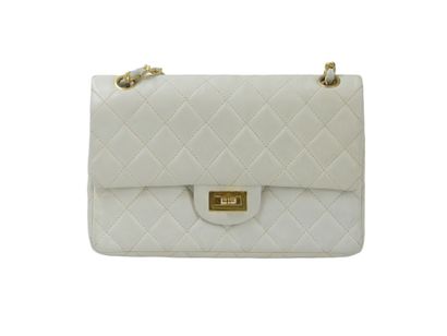 CHANEL. Classic quilted bag in white lambskin,...