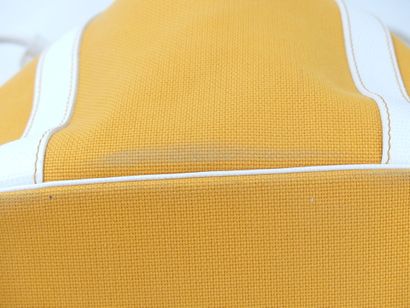 LANCEL. Orange canvas bucket bag with its...