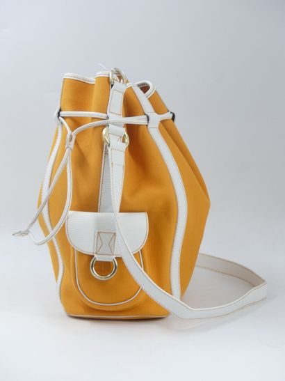 LANCEL. Orange canvas bucket bag with its...