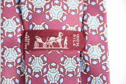 HERMES. Tie in its box, red or burgundy color....