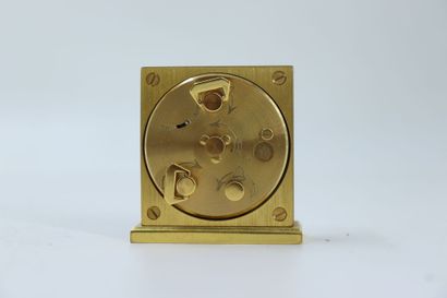 HERMES. Travel alarm clock in gilt metal...
