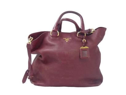 PRADA. Tote bag in dark red grained leather,...
