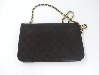 CHANEL. Brown jersey clutch bag, chain handle...