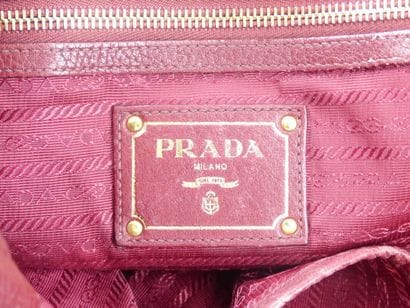 PRADA. Tote bag in dark red grained leather,...