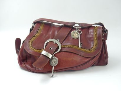 Christian DIOR. Saddle bag in red and gold...