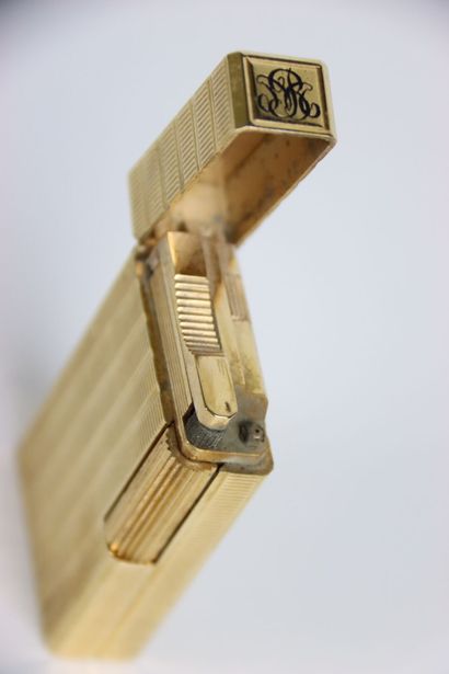 S.T. DUPONT BRIQUET in gilded metal with...