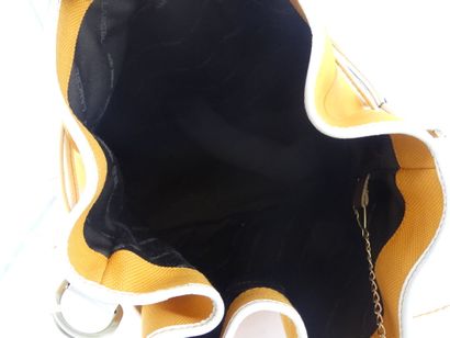 LANCEL. Orange canvas bucket bag with its...