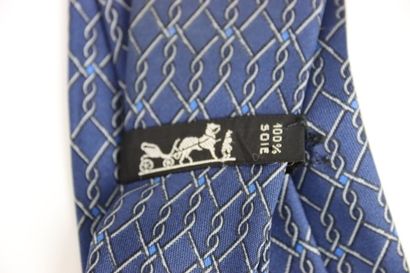 HERMES. Dark blue tie, in its box in perfect...
