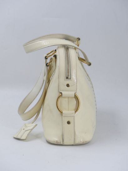 Yves Saint Laurent. Cream patent leather...