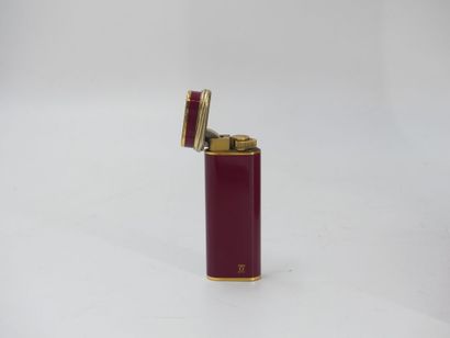 CARTIER. Must. Lighter in gilt metal and...