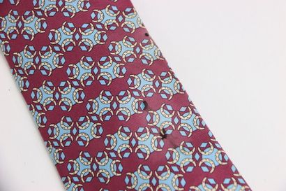 HERMES. Tie in its box, red or burgundy color....