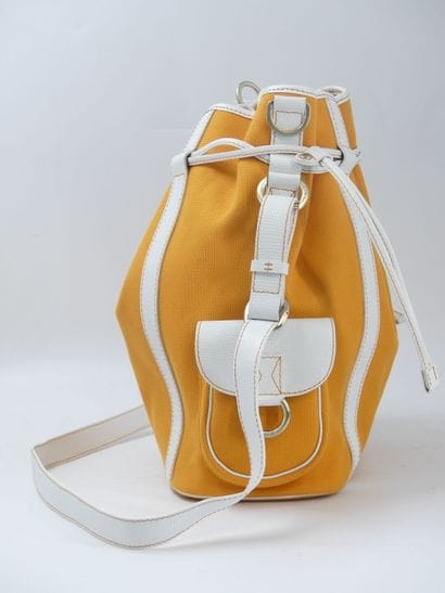 LANCEL. Orange canvas bucket bag with its...