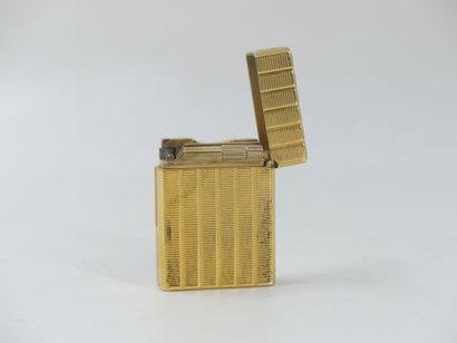 DUPONT. Lighter in gilded metal, monogrammed...