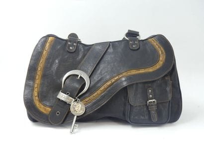 DIOR. Saddle bag in black and gold calfskin,...