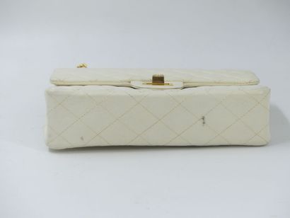 CHANEL. Classic quilted bag in white lambskin,...