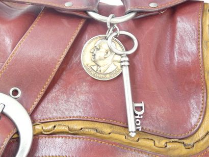 Christian DIOR. Saddle bag in red and gold...