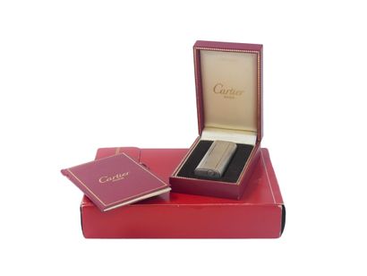 CARTIER. Lighter in silver plated metal,...