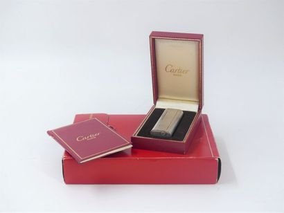 CARTIER. Lighter in silver plated metal,...