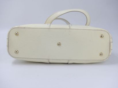 Yves Saint Laurent. Cream patent leather...