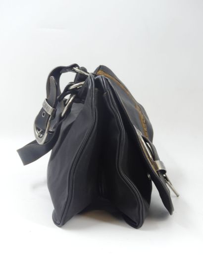 DIOR. Saddle bag in black and gold calfskin,...