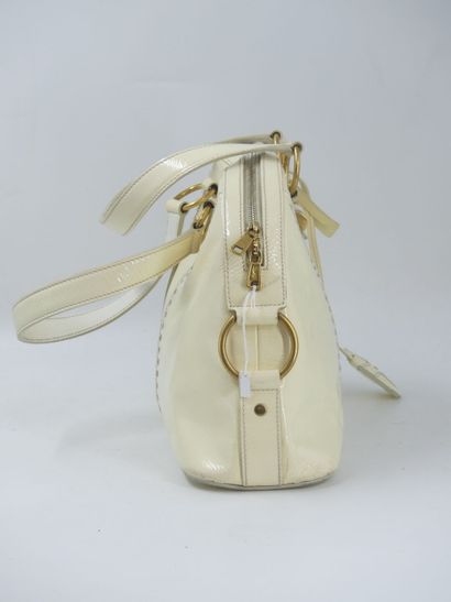 Yves Saint Laurent. Cream patent leather...