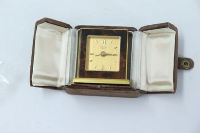 HERMES. Travel alarm clock in gilt metal...