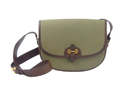 HERMES. Green canvas and leather golf ball...