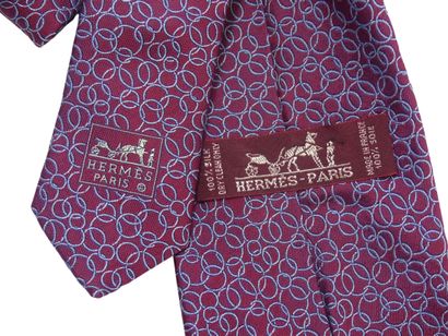 HERMES. Silk tie, cherry background with...