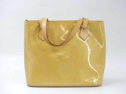 LOUIS VUITTON. Handbag in yellow patent canvas...