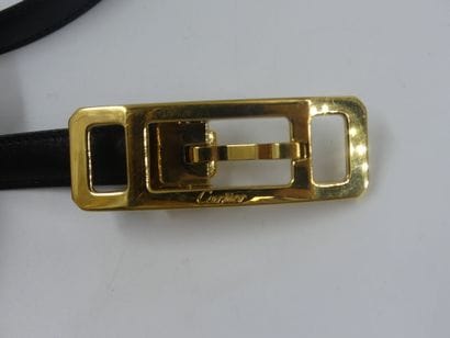 CARTIER. Black leather belt and gold metal...