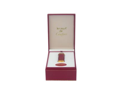 CARTIER. Must. Lighter in gilt metal and...