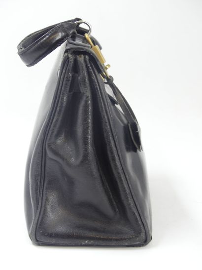 HERMES. Kelly bag 28cm in black box, gold...