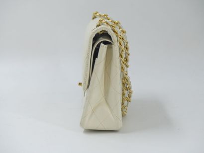 CHANEL. Classic quilted bag in white lambskin,...