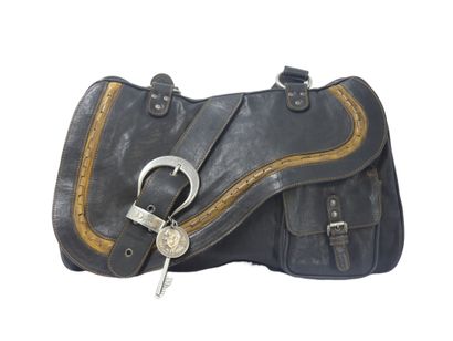 DIOR. Saddle bag in black and gold calfskin,...