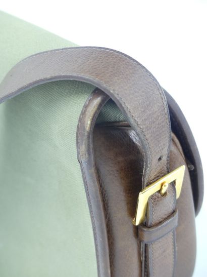 HERMES. Green canvas and leather golf ball...