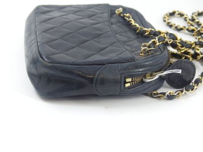 CHANEL. Small quilted camera bag in navy...
