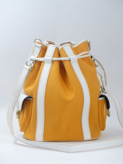 LANCEL. Orange canvas bucket bag with its...